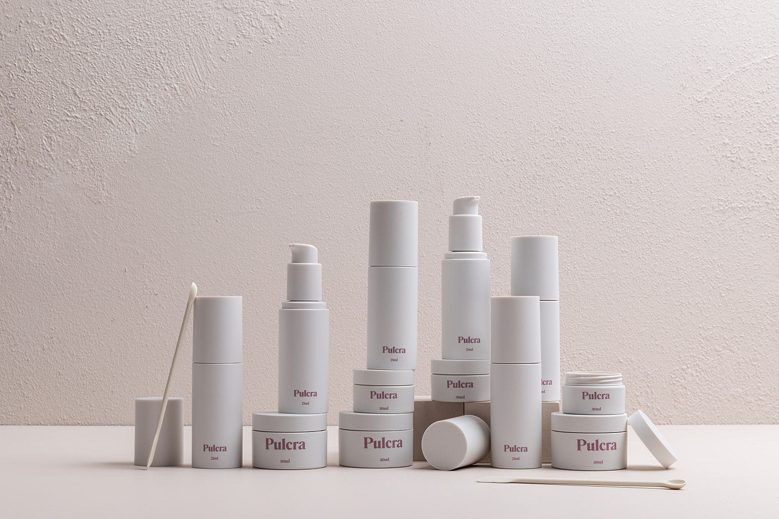 Premium refillable travel set bundle in milk, carry-on approved bottles and jars. TSA approved refillable travel containers for beauty and cosmetic products.