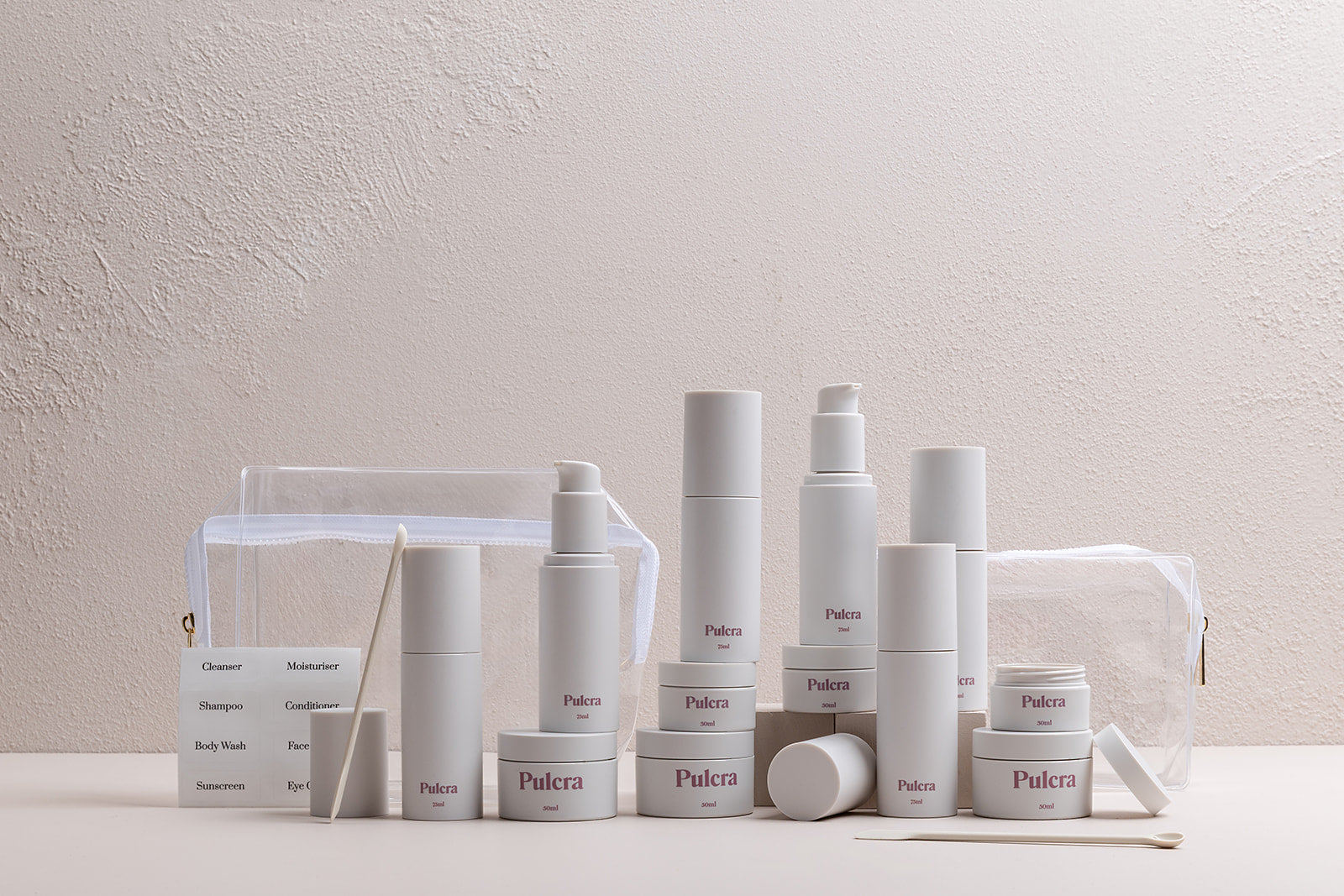 Premium refillable travel set bundle in milk, carry-on approved bottles and jars. TSA approved refillable travel containers for beauty and cosmetic products.