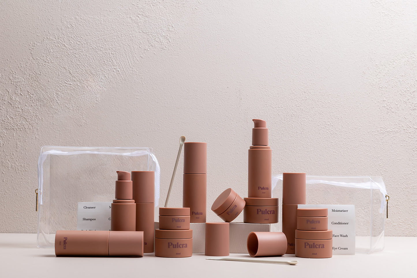 Premium refillable travel set bundle in chocolate, carry-on approved bottles and jars. TSA approved refillable travel containers for beauty and cosmetic products.